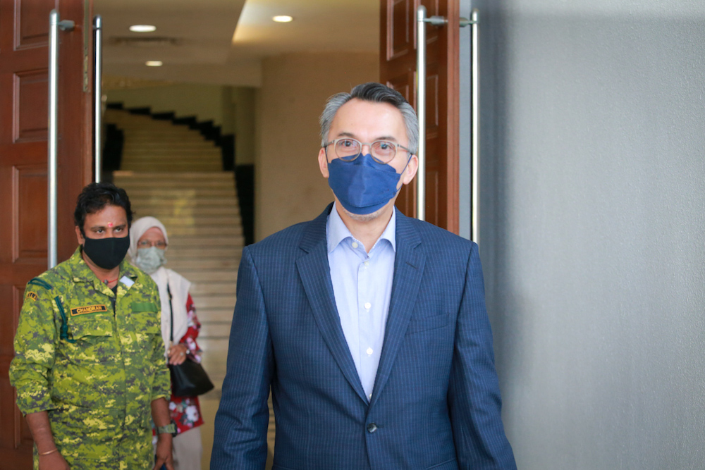 Former 1MDB director Tan Sri Ismee Ismail leaves the Kuala Lumpur High Court, March 24, 2022. — Picture by Devan Manuel