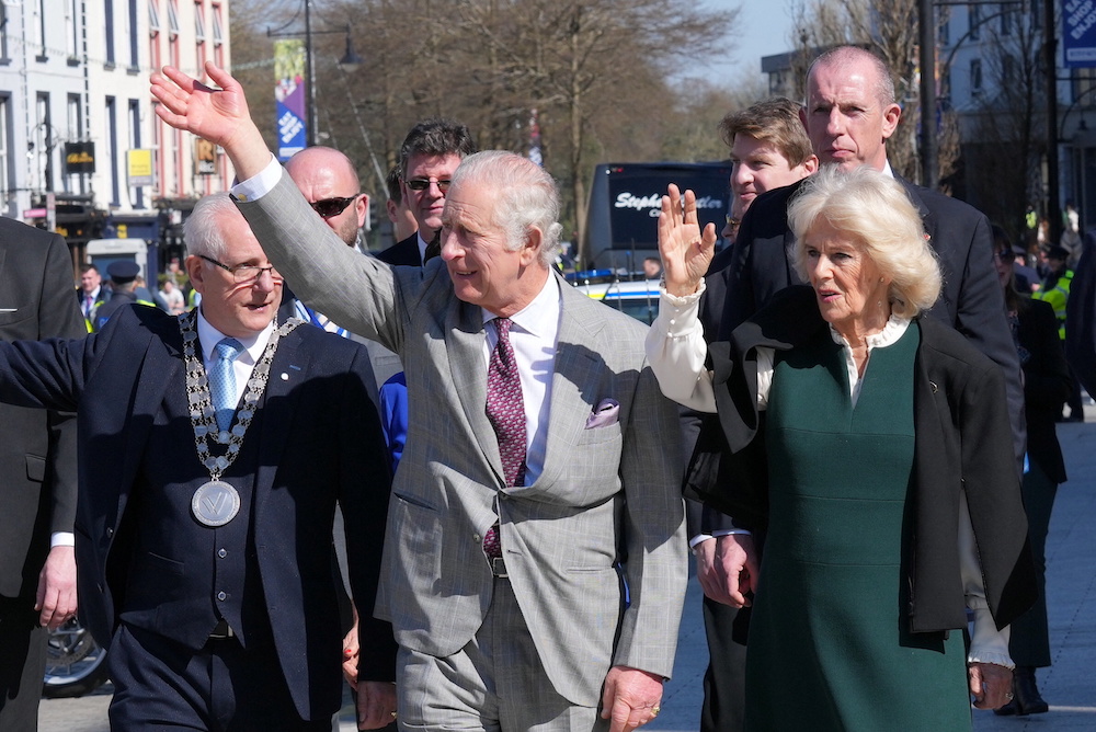 Britain's Prince Charles and Camilla, Duchess of Cornwall, wave during a public walkabout in Waterford, Ireland March 24, 2022. u00e2u20acu201d Mark Cutbert/Pool via Reuters