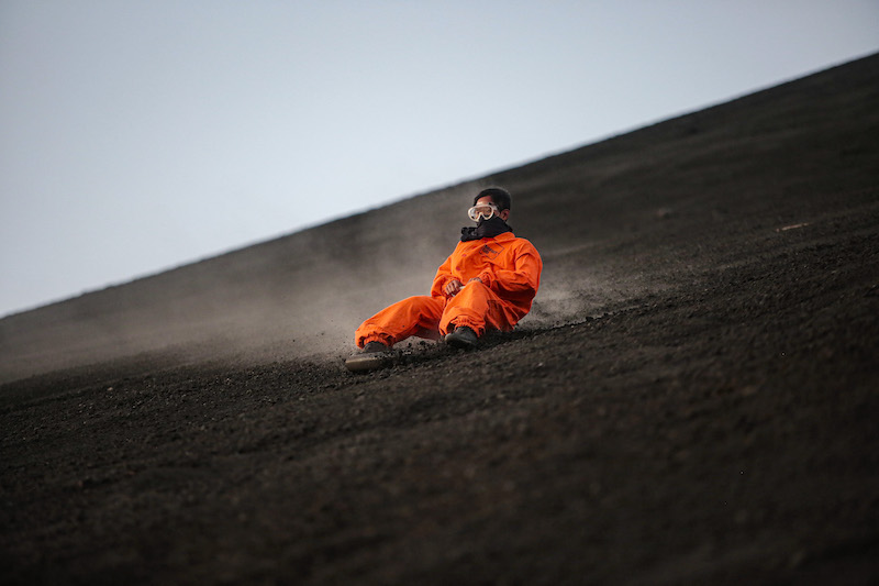 A tourist slides down the slopes of the Cerro Negro volcano, one of the youngest in Central America and one of the most active in the country, in Leon, Nicaragua March 22, 2022. u00e2u20acu201d AFP pic