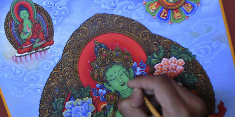 Paubha artist Ujay Bajracharya works on his rendition of the Green Tara, a goddess of compassion revered by Buddhists and Hindus in the country, in Lalitpur on the outskirts of Kathmandu. u00e2u20acu201d AFP pic