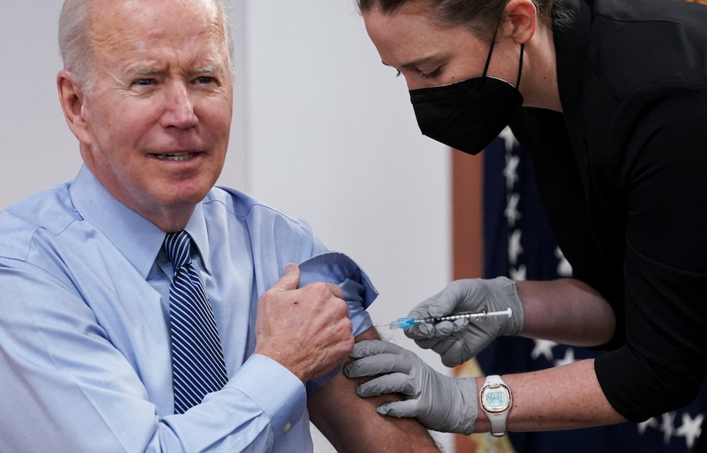 US President Joe Biden receives a second Covid-19 booster vaccination after delivering remarks on Covid-19 at the White House in Washington March 30, 2022. u00e2u20acu201d Reuters pic