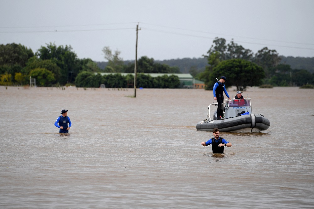 NSW Police Rescue are seen patrolling in floodwater at Windsor, north west of Sydney, Australia, March 3, 2022. u00e2u20acu2022 AAP Image/Dan Himbrechts via Reuters