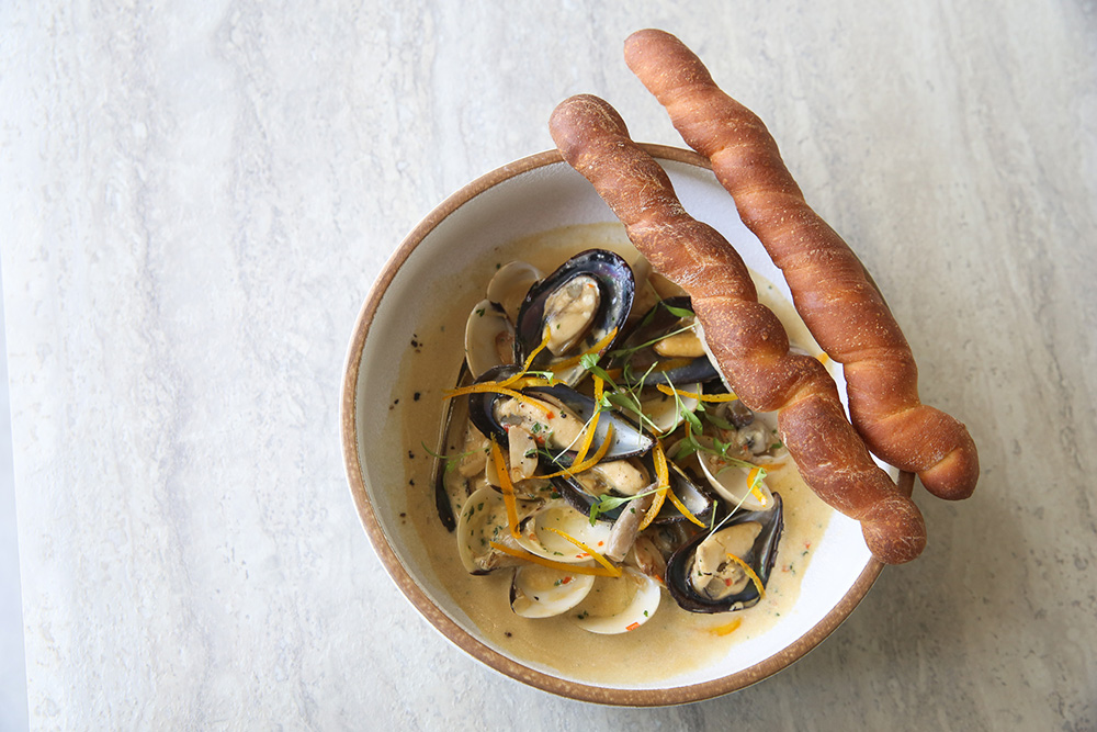 Try out their one of the kind candied orange peels brioche grissini with the creamy chilli clams and mussels served with shimeji mushrooms from Mabel by Cookhouse.