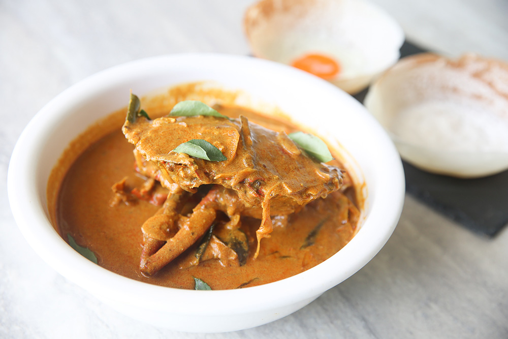 Pair those fluffy 'appams' with a rich tasting crab curry from Aliyaa.