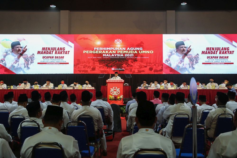 Datuk Asyraf Wajdi Dusuki delivers his speech at the opening ceremony of the 2021 Umno General Assembly for the Youth wing in Kuala Lumpur March 17, 2022. u00e2u20acu201d Picture by Yusof Mat Isa