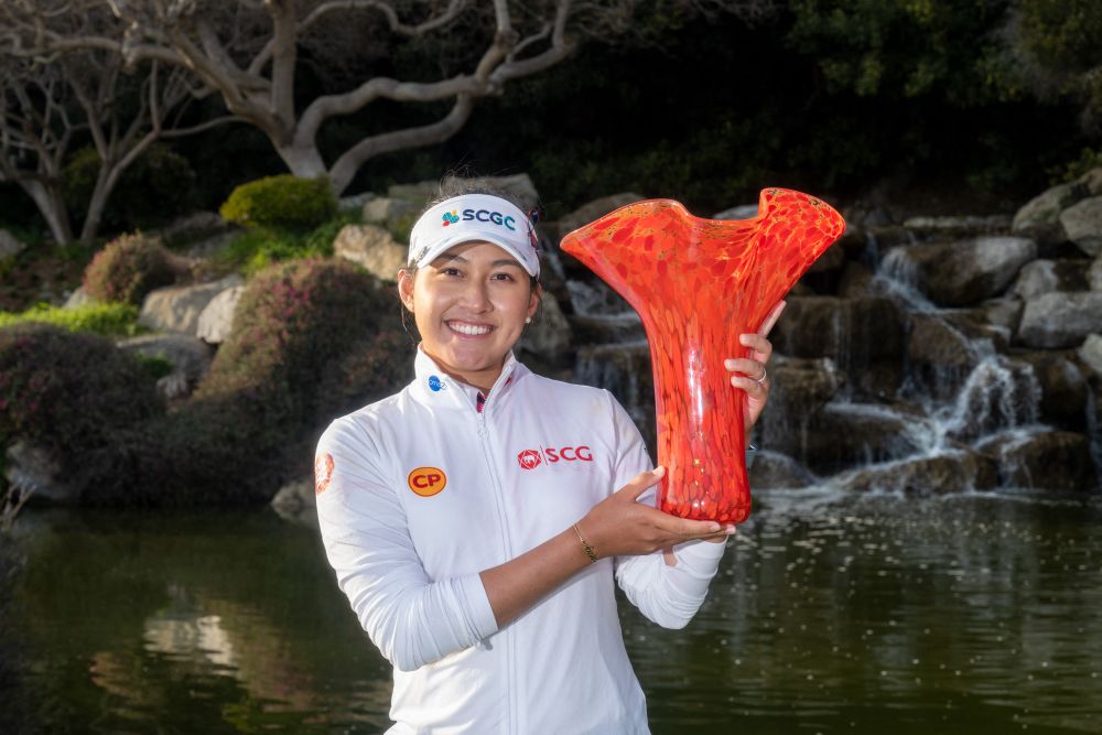 Atthaya Thitikul holds the winneru00e2u20acu2122s trophy after her -16 playoff win over Nana Koerstz Madsen during the final round of the JTBC Classic at the Aviara Golf Club in California March 27, 2022. u00e2u20acu201d AFP pic
