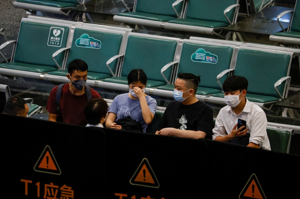 Relatives of the passengers of the China Eastern Airlines Boeing 737-800 plane, which crashed in Wuzhou, seen at Guangzhou Baiyun International Airport in Guangzhou, Guangdong province, China March 22, 2022. u00e2u20acu2022 Reuters pic