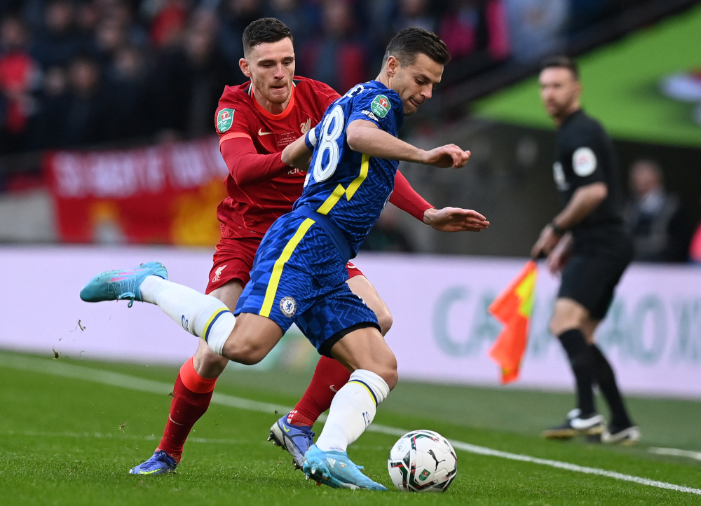 Liverpool defender Andrew Robertson vies with Chelsea defender Cesar Azpilicueta during the English League Cup final match at Wembley Stadium, London, February 27, 2022. u00e2u20acu201d AFP pic 