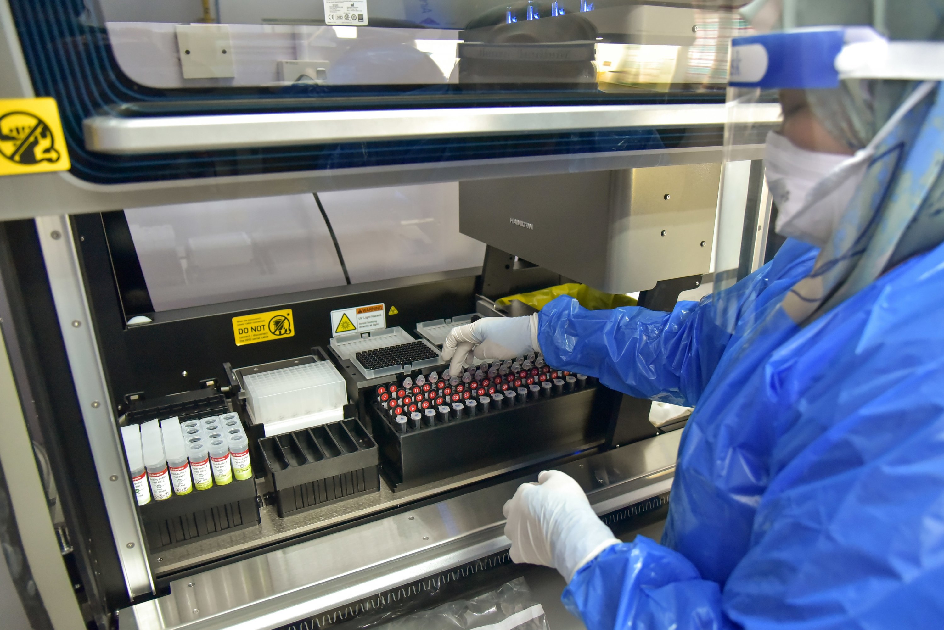 A medical worker conducts Covid-19 polymerase chain reaction tests. u00e2u20acu201d Bernama pic
