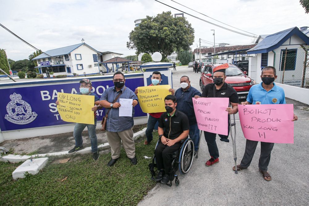 Persatuan Sahabat OKU Perak lodging a police report at Sungai Senam station in Ipoh, March 18, 2022,  against a woman said to make fun of people with disabilities. u00e2u20acu201d Picture by Farhan Najib