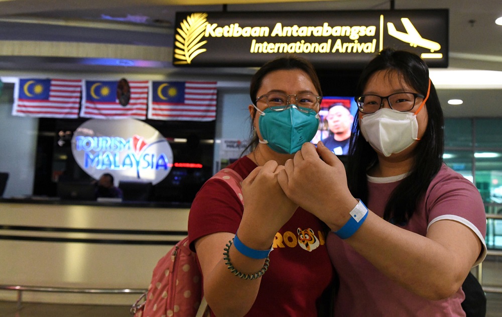 Travellers arrive at the Penang International Airport under the VTL by Air programme between Singapore and Penang, in George Town March 16, 2022. u00e2u20acu201d Bernama pic