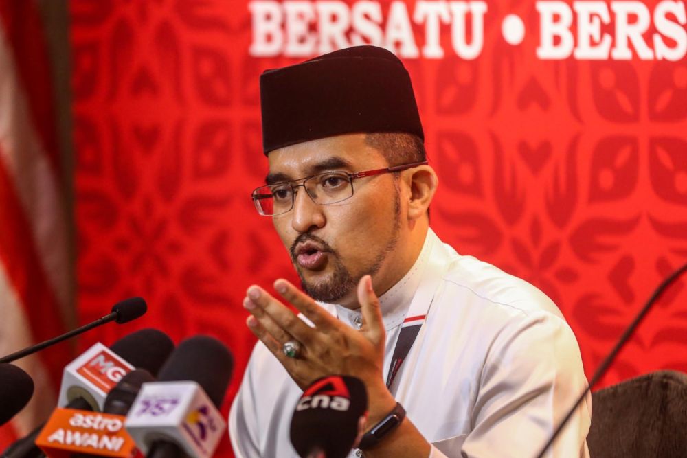 Umno Youth chief Datuk Asyraf Wajdi Dusuki speaking to reporters at a press conference during the Umno General Assembly 2021 in Dewan Merdeka, World Trade Center (WTC), Kuala Lumpur, March 18, 2022. u00e2u20acu201d Picture by Hari Anggara