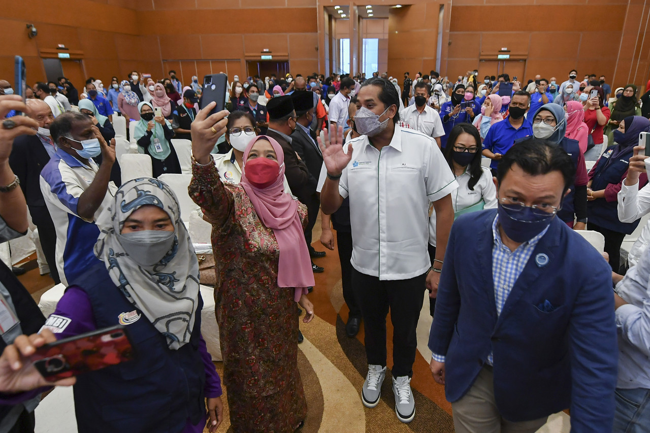 Health Minister Khairy Jamaluddin with volunteers at the launch of 'MyCHAMPION - Community Health Agent' National Level 2022 in Sepang, March 26, 2022. u00e2u20acu201d Bernama pic