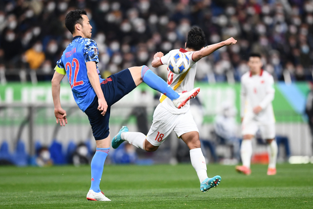 Japanu00e2u20acu2122s Maya Yoshida (left) fights for the ball with Vietnamu00e2u20acu2122s Ha Duc Chinh during the Fifa World Cup Qatar 2022 Asian zone qualification football match at Saitama Stadium in Saitama, Japan, March 29, 2022. u00e2u20acu2022 AFP pic