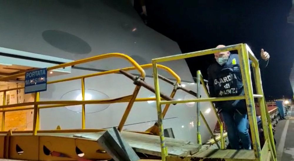 A Finance Police officer boards the superyacht from Russian billionaire Andrey Igorevich Melnichenko which has been sequestered at the northern port of Trieste, Italy, March 12, 2022, in this screen grab taken from video. u00e2u20acu2022 Reuters pic