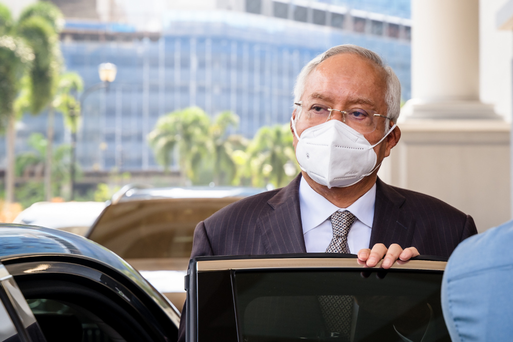 Datuk Seri Najib Razak leaves the Kuala Lumpur High Court complex, March 21, 2022. — Picture by Devan Manuel