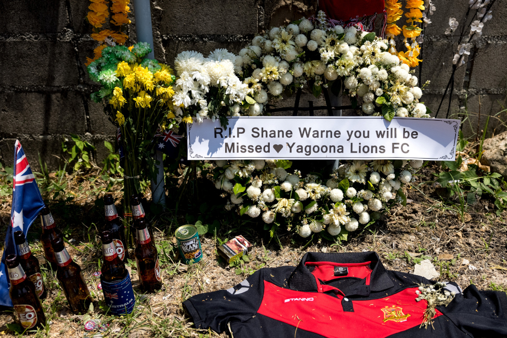 Tributes to the late Australian cricket player Shane Warne are seen outside Samujana Villas on Thailandu00e2u20acu2122s Koh Samui March 7, 2022, after the sportsman died of a suspected heart attack on March 4 after being found unresponsive in the luxury resort. u00e2u20acu201d A