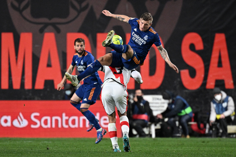 Rayo Vallecano forward Radamel Falcao (bottom) fights for the ball with Real Madrid midfielder Toni Kroos (top) during the Spanish league match at the Vallecas stadium in Madrid, February 26, 2022. u00e2u20acu201d AFP picnn