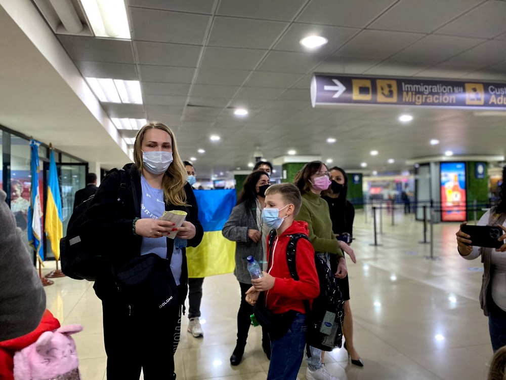 A Ukrainian family fleeing their homeland following Russia's invasion of Ukraine, arrive at La Aurora International airport in Guatemala City, Guatemala March 11, 2022. u00e2u20acu2022 Guatemala Ministry of Foreign Relations/Handout via Reuters