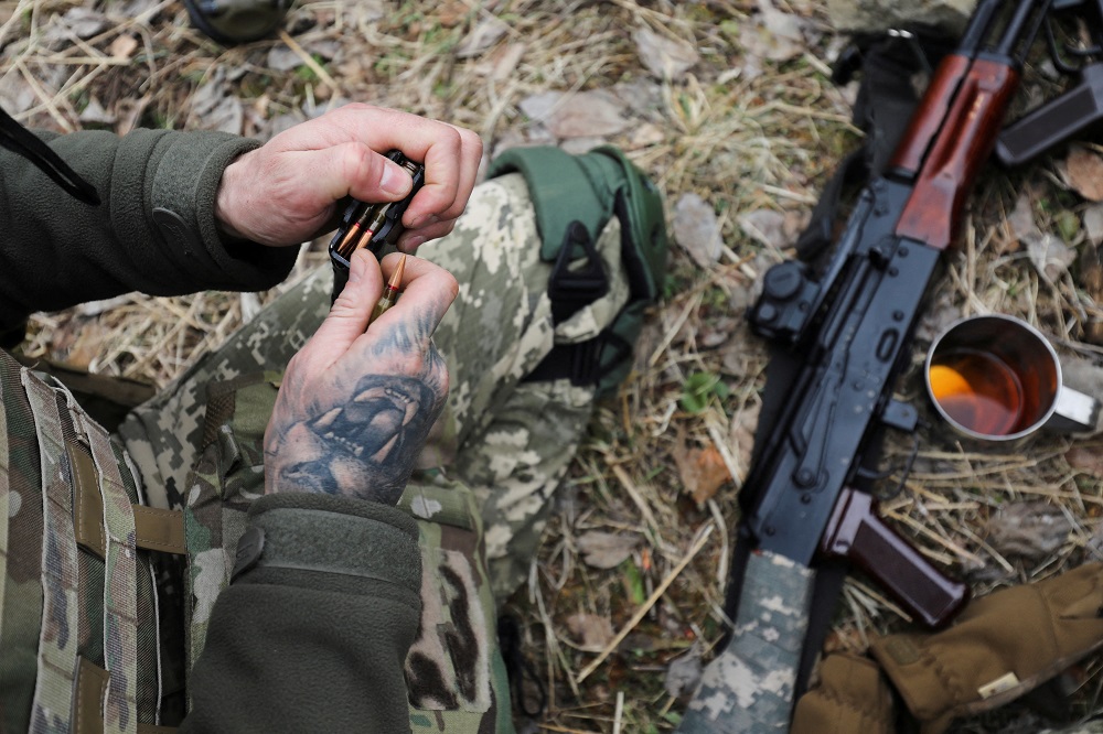 A member of the Ukrainian Territorial Defence Forces loads a magazine during tactical exercises, amid Russia's invasion of Ukraine, near Lviv, Ukraine March 16, 2022. u00e2u20acu2022 Reuters pic