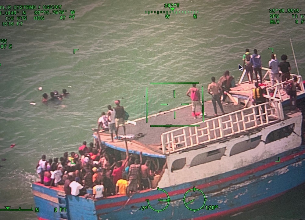 A boat packed with 356 Haitian migrants, which ran aground off Ocean Reef, is seen in a still image from a surveillance camera video as the US Coast Guard attended in the Florida Keys, Florida, US March 6, 2022. u00e2u20acu2022 US Coast Guard/Handout via Reuters