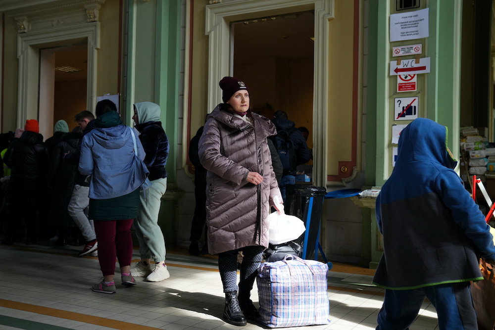 People fleeing the Russian invasion of Ukraine, wait at the train station in Przemysl, Poland, March 12, 2022. u00e2u20acu2022 Reuters picnn