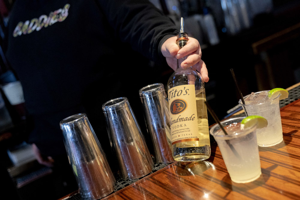 Ronnie Heckman, 31, holds Titou00e2u20acu2122s handmade in Texas Vodka, which he used to prepare a Kyiv Mule, traditionally called a Moscow Mule, at Caddies bar and grill in Bethesda, Maryland. u00e2u20acu201d AFP pic