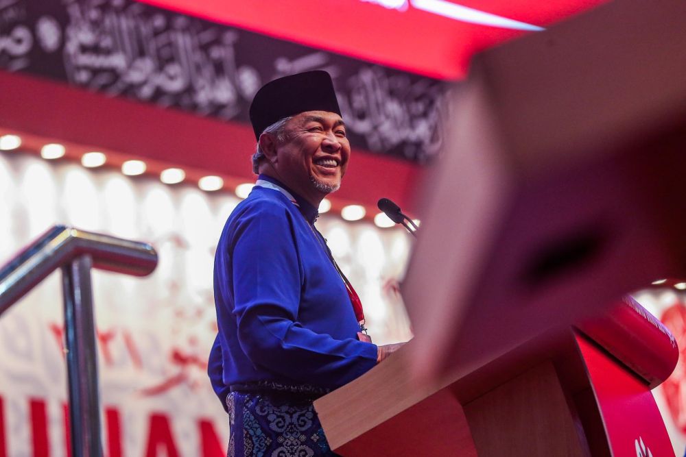 Umno president Datuk Seri Ahmad Zahid Hamidi delivers a speech at the 2021 Umno General Assembly at the World Trade Centre Kuala Lumpur March 19, 2022. u00e2u20acu201d Picture by Hari Anggara
