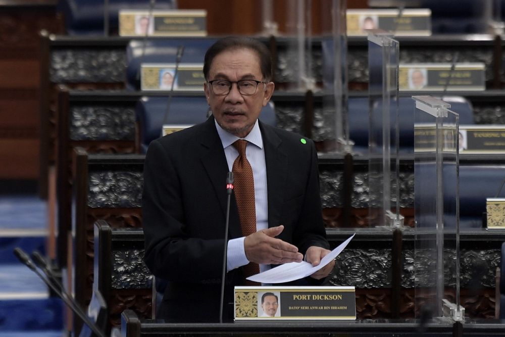 Opposition Leader Datuk Seri Anwar Ibrahim addresses members of Parliament in Dewan Rakyat March 1, 2022. u00e2u20acu2022 Bernama pic