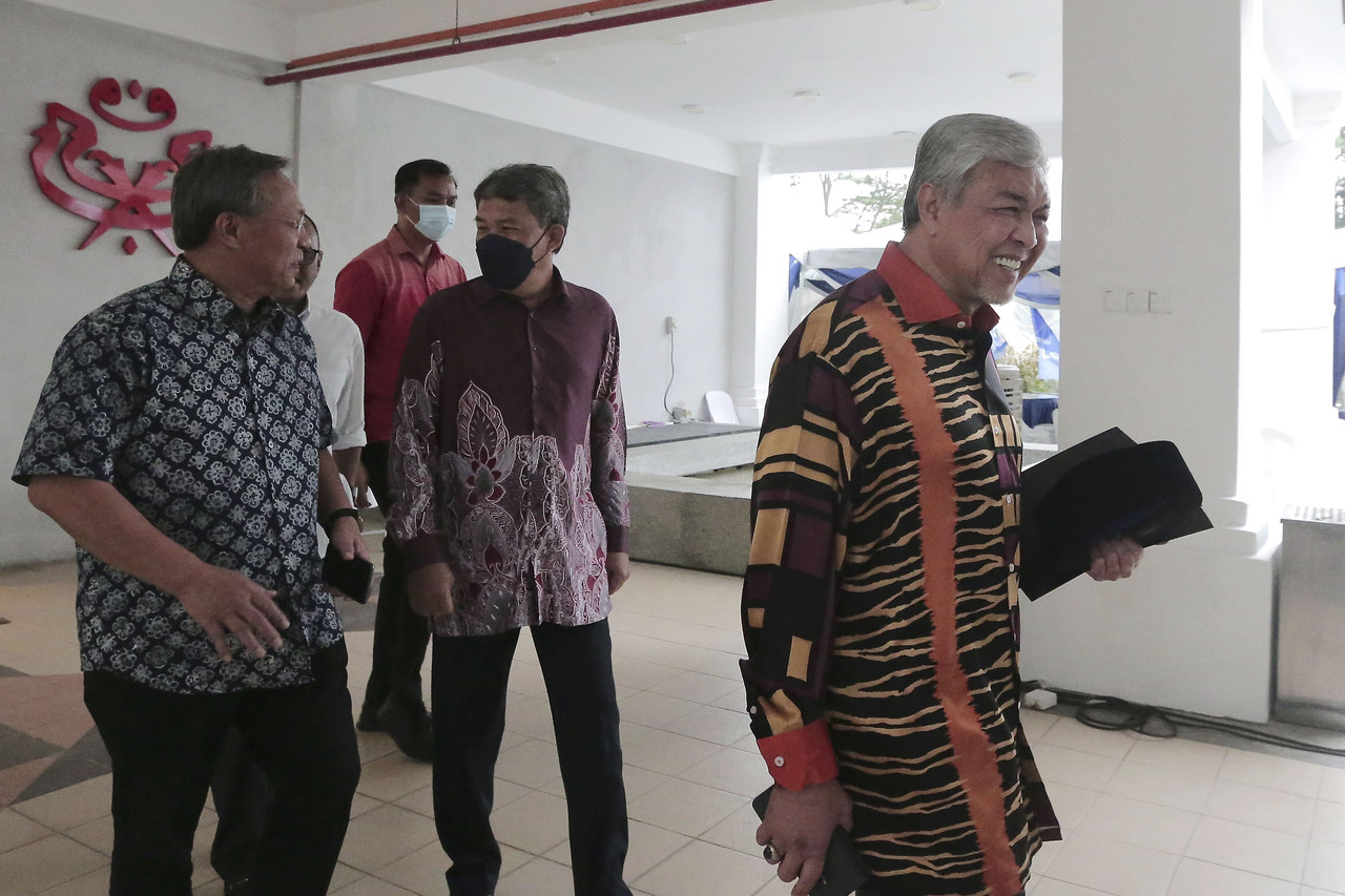 Datuk Seri Ahmad Zahid Hamidi (right) leaves the Johor Umno office after a meeting in Johor Baru March 14, 2022. u00e2u20acu201d Bernama pic