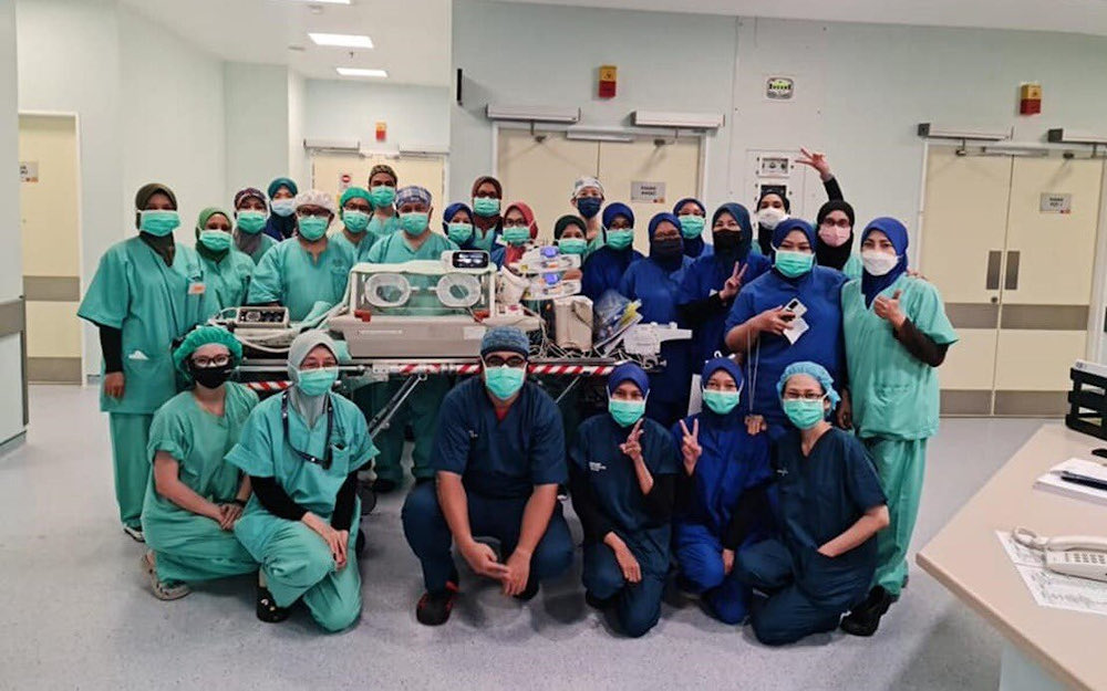 The premature conjoined twins were successfully separated through surgery led by HTA paediatric surgery consultant specialist Datuk Dr Zakaria Zahari at the Hospital Tunku Azizah (HTA) March 20, 2022. u00e2u20acu201d Picture via Twitter/Bernama