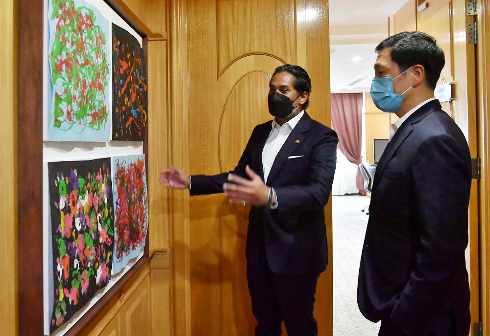 Malaysiau00e2u20acu2122s health minister Khairy Jamaluddin with his Singaporean counterpart Ong Ye Kung (right) during the latteru00e2u20acu2122s visit to the Ministry of Health in Putrajaya March 23, 2022. u00e2u20acu201d Bernama pic