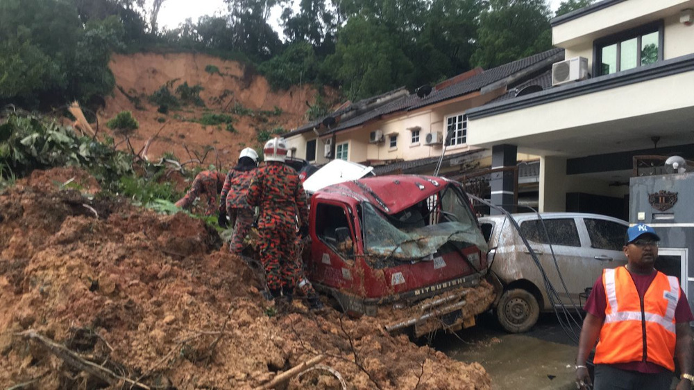 Fire and Rescue Department personnel aid in rescue efforts after a landslide in Ampang March 10, 2022. u00e2u20acu201d Picture courtesy of Fire and Rescue Department