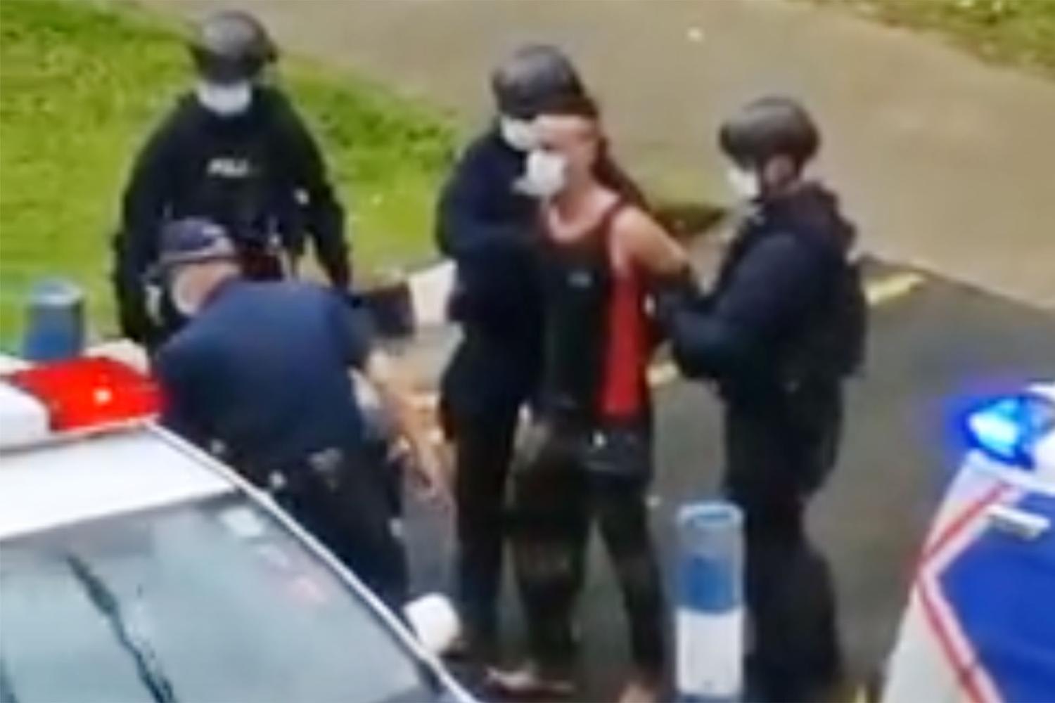 A screenshot from a video of Fadhil Yusop being apprehended by police officers on March 14, 2022. u00e2u20acu2022 Picture via social media