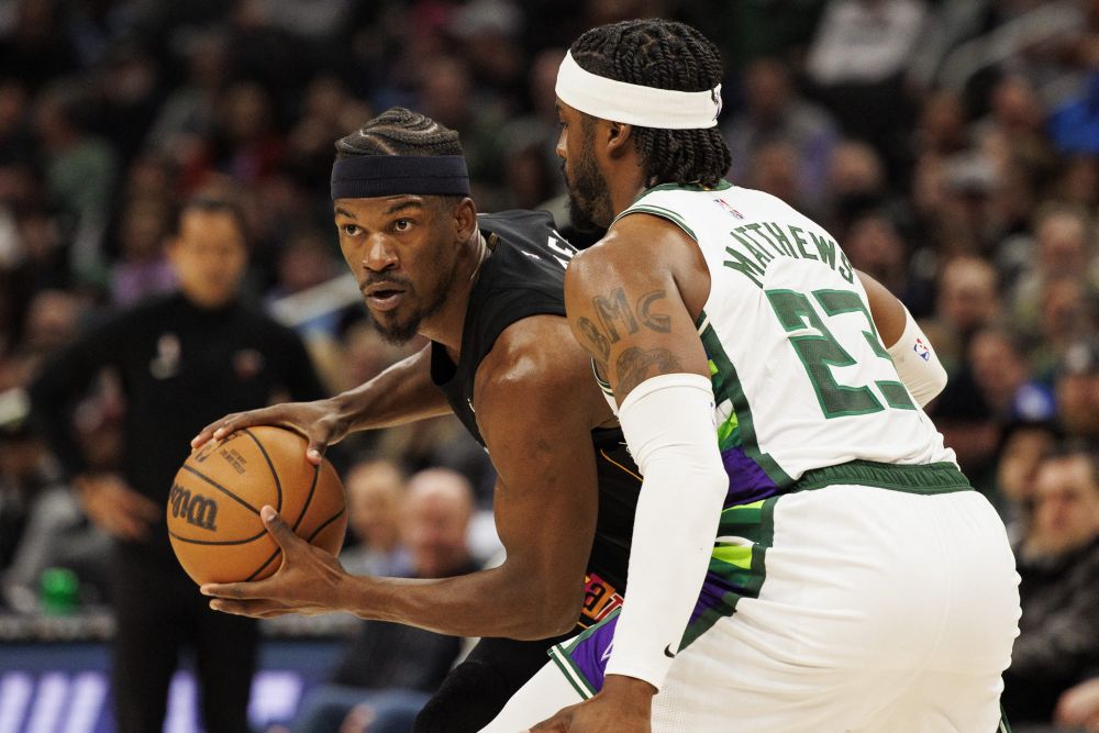 Miami Heat forward Jimmy Butler (22) holds the ball away from Milwaukee Bucks guard Wesley Matthews (23) at Fiserv Forum March 2, 2022. u00e2u20acu201d Reuters picnn