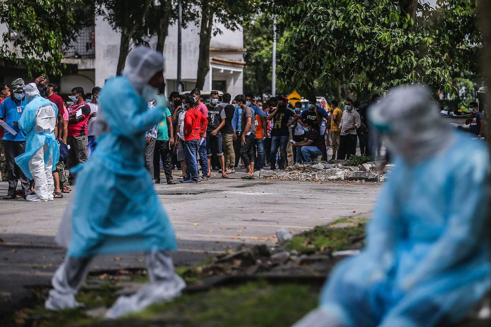 Health personnel conducting Covid-19 screening on migrant workers at their residence in Pulau Indah, Klang. — Picture by Hari Anggara