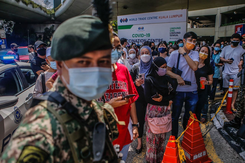 Malaysians waiting to get into the Covid-19 vaccination centre at the Putra World Trade Centre. — Picture by Hari Anggara