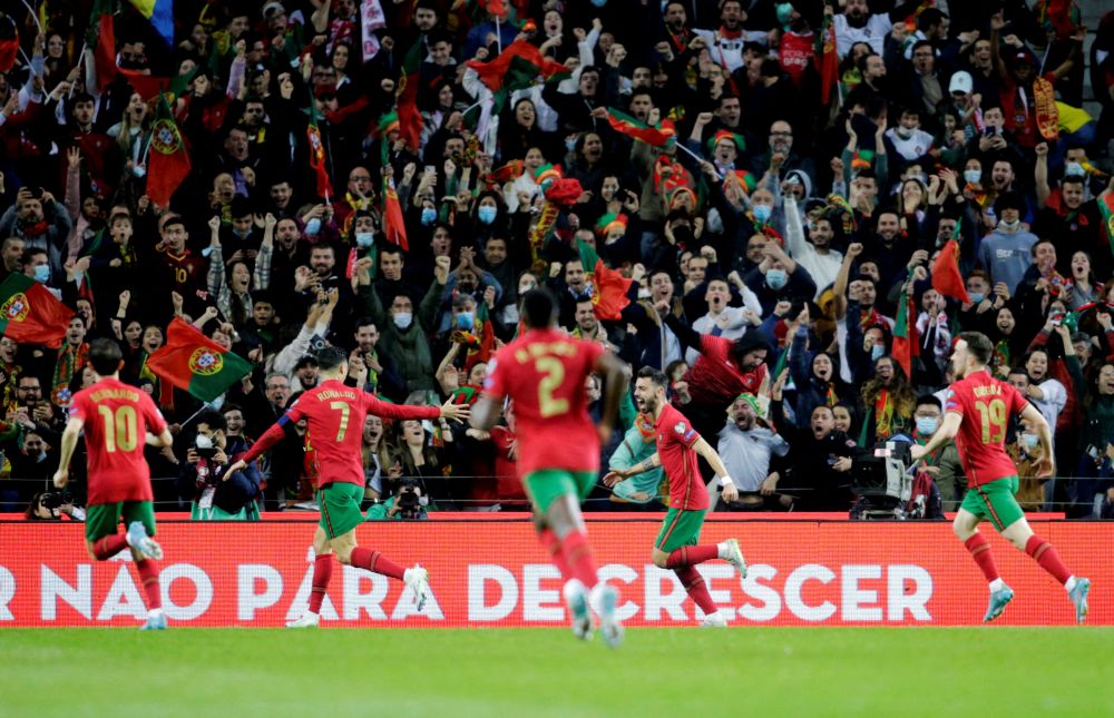 Portugal's Bruno Fernandes (second from right) celebrates scoring their first goal against North Macedonia with teammates at Estadio do Dragao, Porto March 29, 2022. u00e2u20acu201d Reuters pic