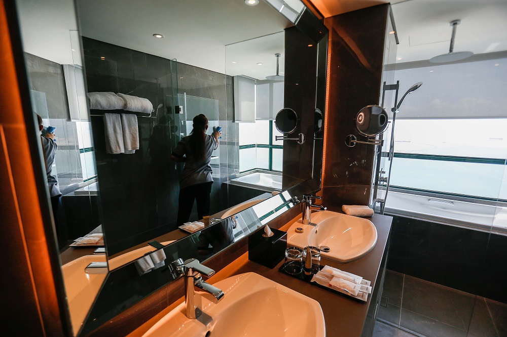 A housekeeping staff is seen tidying up a room in a hotel in George Town March 3, 2022. u00e2u20acu2022 Picture by Sayuti Zainudin