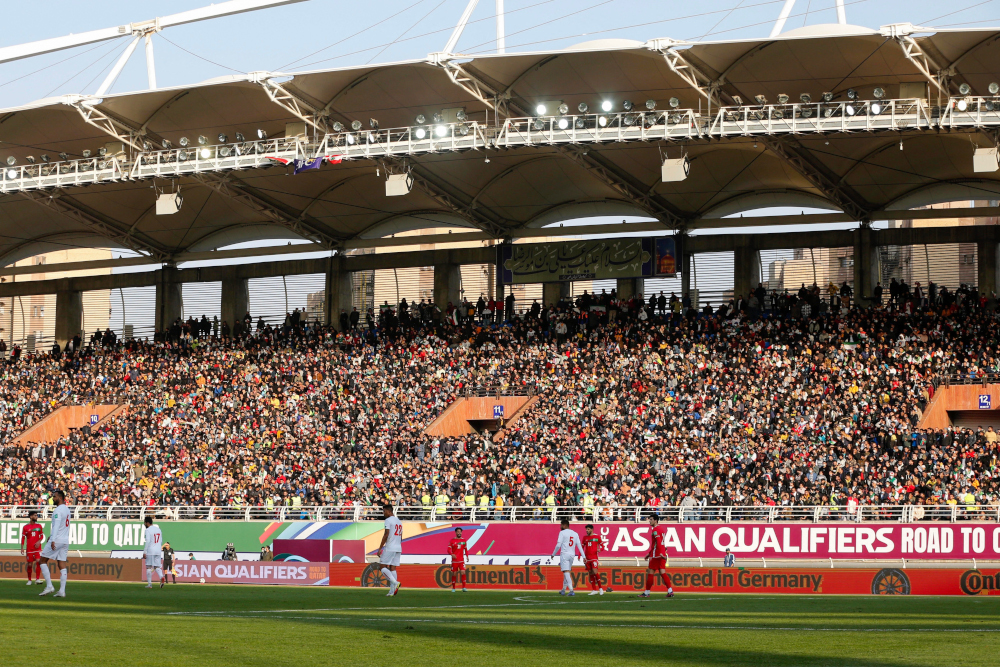 Supporters watch the 2022 Qatar World Cup Asian Qualifiers match between Iran and Lebanon, at the Imam Reza Stadium in the city of Mashhad, March 29, 2022. u00e2u20acu201d AFP picnn