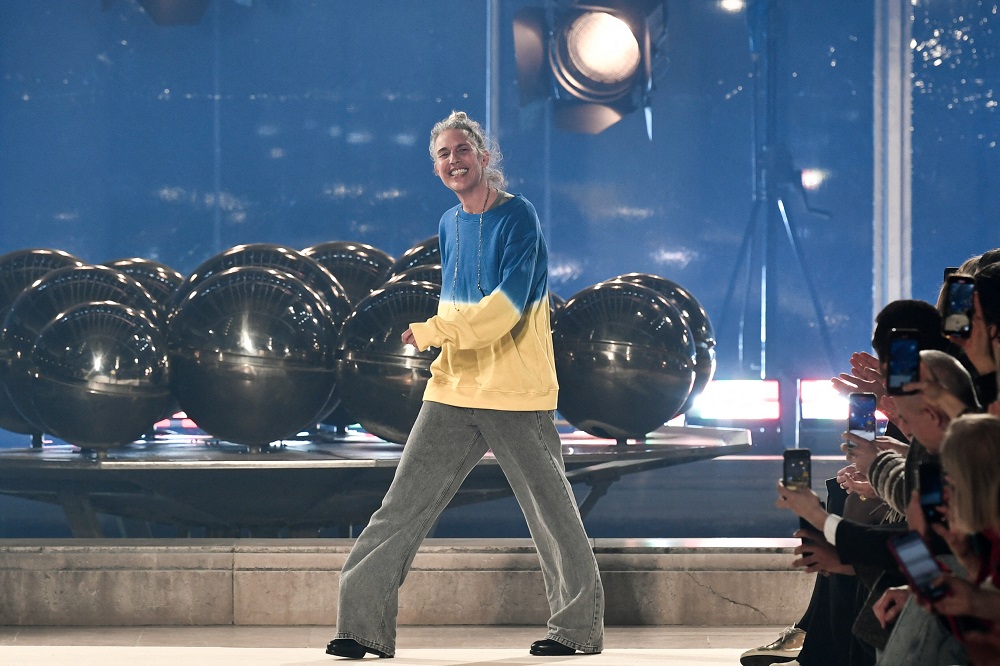 The designer Isabel Marant stepped out to greet the audience at the end of her fashion show wearing a sweater with the colours of the Ukrainian flag. u00e2u20acu2022 AFP pic