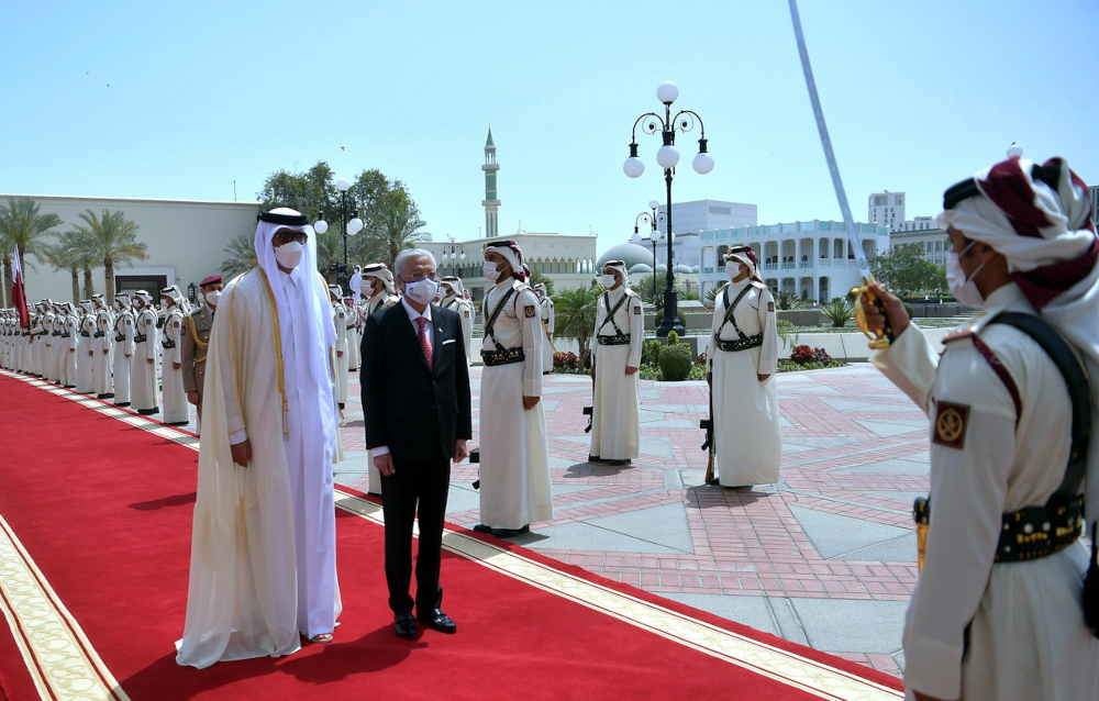 Prime Minister Datuk Seri Ismail Sabri Yaakob with Amir of Qatar Sheikh Tamim bin Hamad Al Thani (front, left) during an inspection of the Guards of Honour at the Amiri Diwan in Doha, March 29, 2022. u00e2u20acu201d Bernama pic 