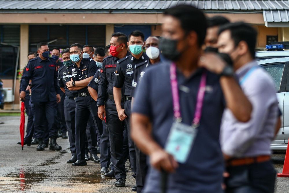 Police personnel wait to cast their votes during early voting for the Johor state election in Johor Baru March 8, 2022. u00e2u20acu201d Picture by Hari Anggara