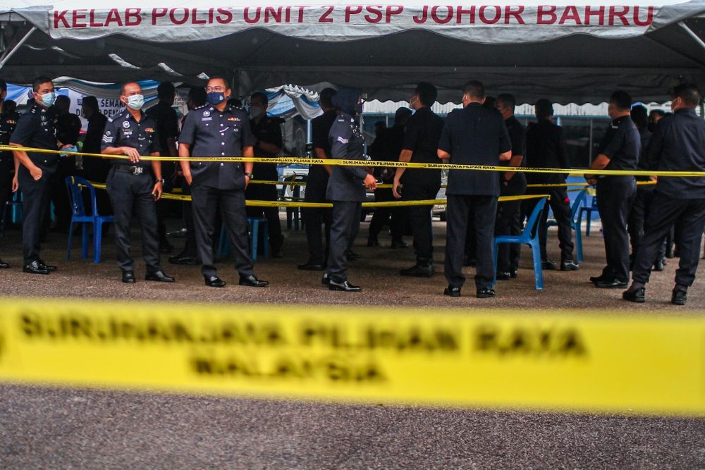 Members of the Royal Malaysia Police cast their vote in the Johor state election at Dato Onn Hall, Johor Contingent Police Headquarters in Johor Baru, March 8, 2022. u00e2u20acu201d Picture by Hari Anggara