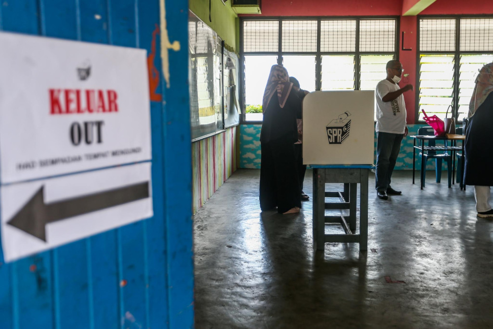 Election Commission officers make final preparations for the voting process in conjunction with the Johor state election at Sekolah Kebangsaan Tanjung Puteri, Johor Baru, March 11, 2022. u00e2u20acu201d Picture by Hari Anggara