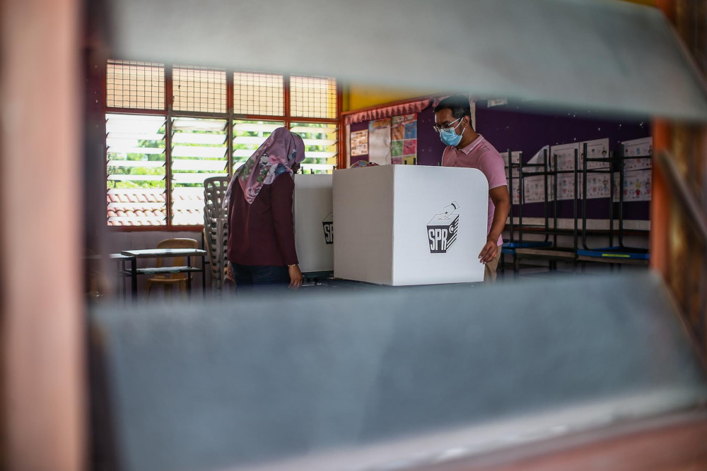 Election Commission officers make final preparations for the voting process in conjunction with the Johor state election at Sekolah Kebangsaan Tanjung Puteri, Johor Baru, March 11, 2022. u00e2u20acu201d Picture by Hari Anggara