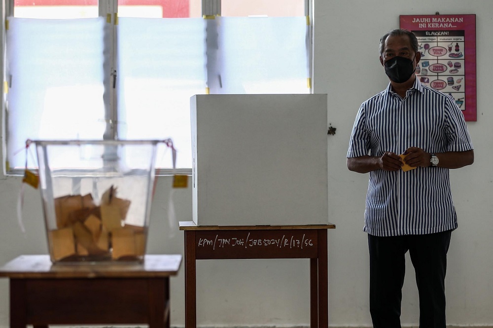 Perikatan Nasional chairman Tan Sri Muhyiddin Yassin casts his ballot at the SMK Sri Muar polling station in Muar, Johor March 12, 2022. u00e2u20acu2022 Picture by Hari Anggara