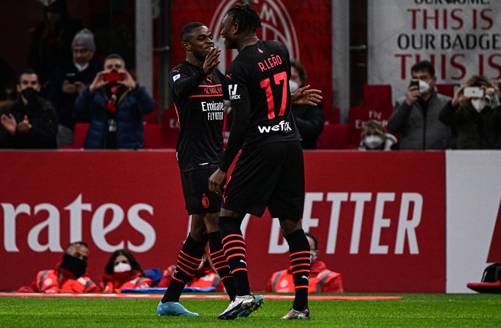 AC Milanu00e2u20acu2122s defender Pierre Kalulu (left) celebrates with AC Milanu00e2u20acu2122s forward Rafael Leao after opening the scoring during the Italian Serie A match between AC Milan and Empoli on March 12, 2022 at the San Siro stadium in Milan. u00e2u20acu201d AFP pic