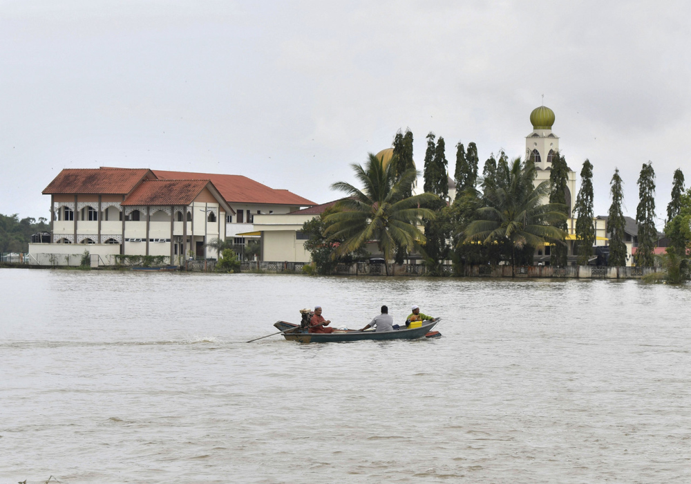 Residents of flood-stricken Kampung Simpangan in Tumpat, Kelantan, have to take a boat to attend Friday prayers, March 4, 2022. u00e2u20acu2022 Bernama pic 
