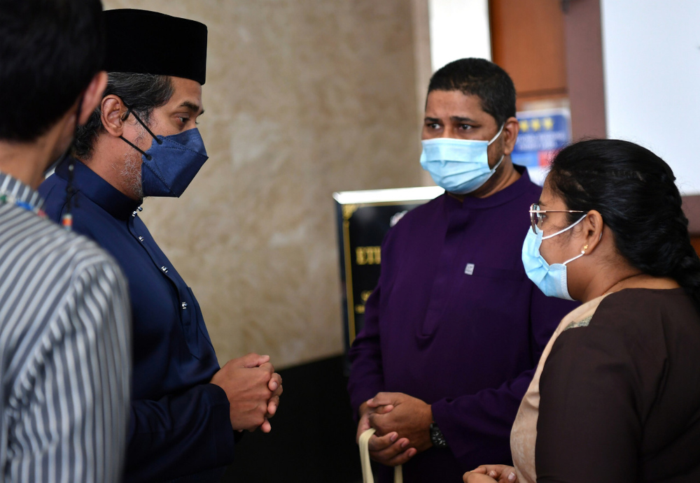 Health Minister Khairy Jamaluddin meets with Naresh Kumar Lachmenou and Vijayarani Govindan, parents of the late Revnesh Kumar, in Putrajaya, March 4, 2022. u00e2u20acu201d Bernama pic 